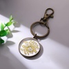 image:imageAUNTESIGN Pressed Flower Keychain Charms  ForgetMeNot Keychain  Personalized Handmade Keychain  Easter Gifts for HerDaffodils and Queen Annes Lace Pressed Wildflower Keychain